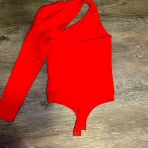 Red one shoulder fitted bodysuit.